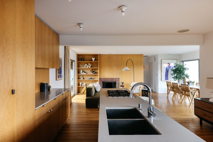 Kitchen with white oak floor-to-ceiling built-ins and inset sink